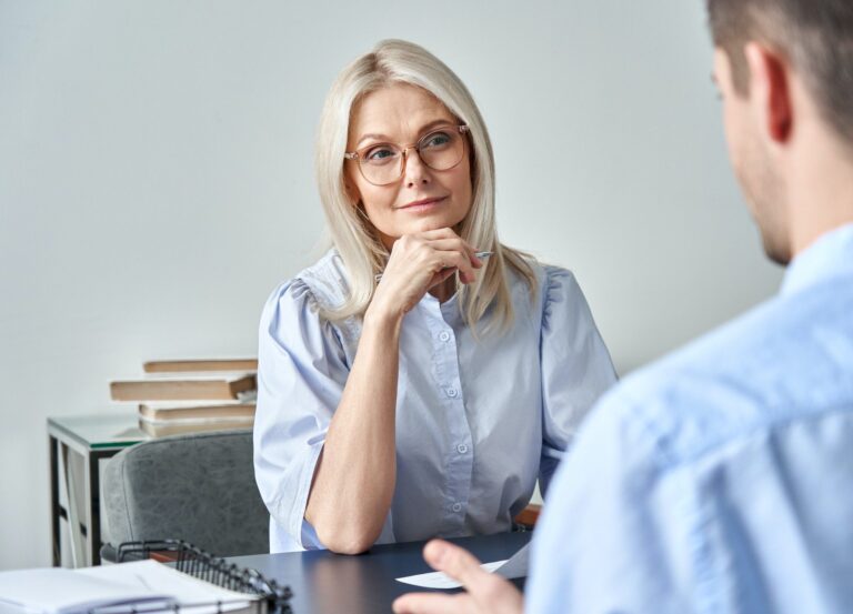 middle aged female hr employer listening candidate at job interview 1